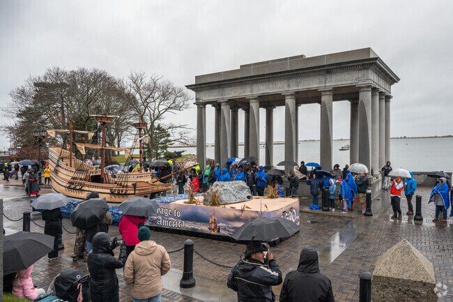 The Mayflower and Plymouth Rock float pass by Pilgrim Memorial State Park.