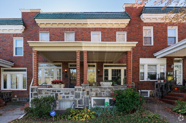 Brick duplexes are a common sight in Herring Run, with well-maintained covered stone porches.