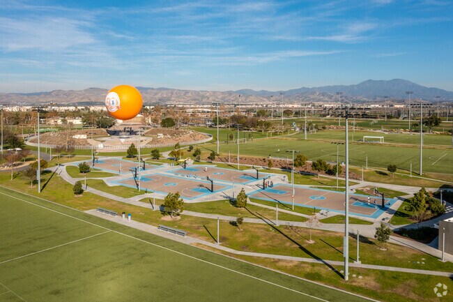 Great Park Sports Complex has basketball courts with the Great Park Balloon nearby.