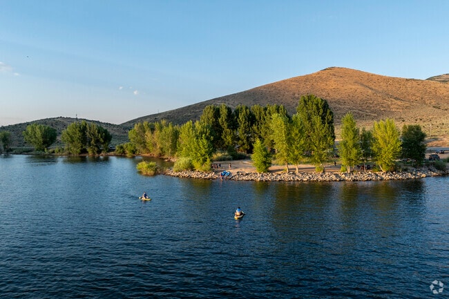Paddle boarders enjoy the sunset on the waters of Deer Creek Reservoir.