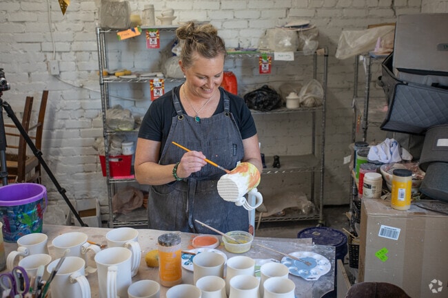 Local artist Nikki Degeneffe paints some of her house made pottery at Spinning Out in Sharon.