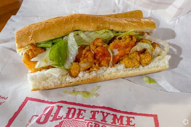 Shrimp po’boy with lettuce and tomato is a favorite at Olde Tyme Grocery in Saints Streets.