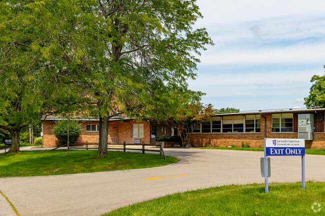 A tall tree shades the entrance of Jackson Christian Elementary School.