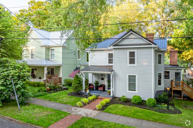 The local farmhouse style homes tend to have small porches and well-tended yards.