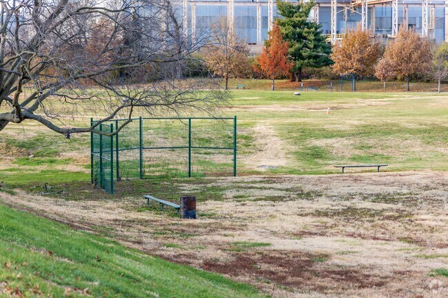 Barrett Brothers Park has a grass softball and baseball field with a fence backstop.