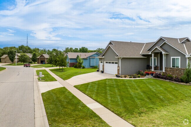 Sidewalks run throughout the front yards of most homes in Falcon Falls.