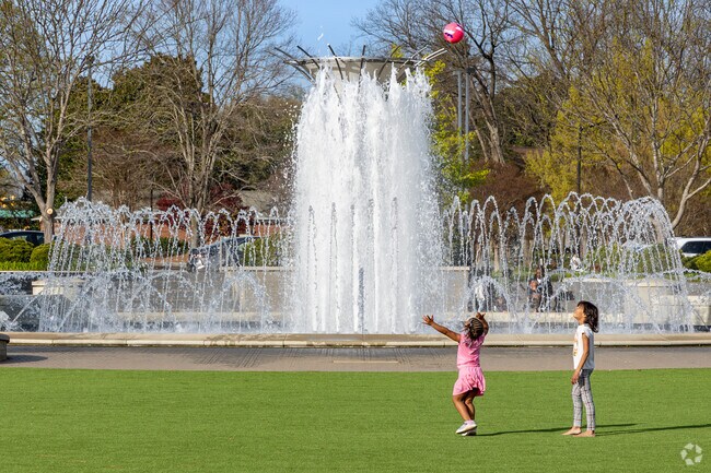 Younger residents love playing on the large green space at Fountain Park.