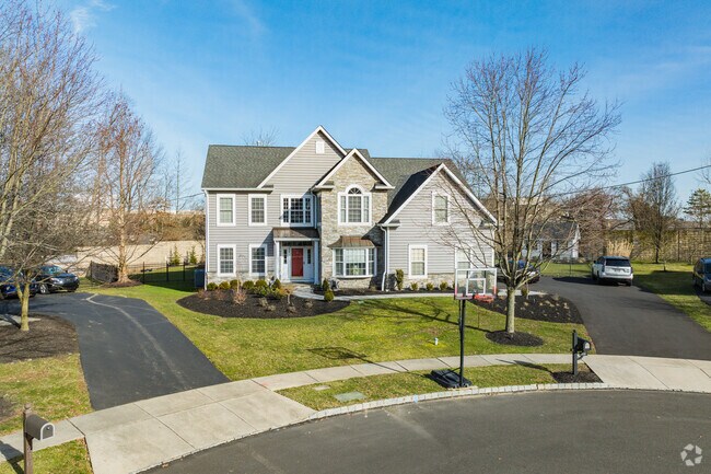 Modern traditional homes sit quietly at the end of a Montgomery Township cul-de-sac.