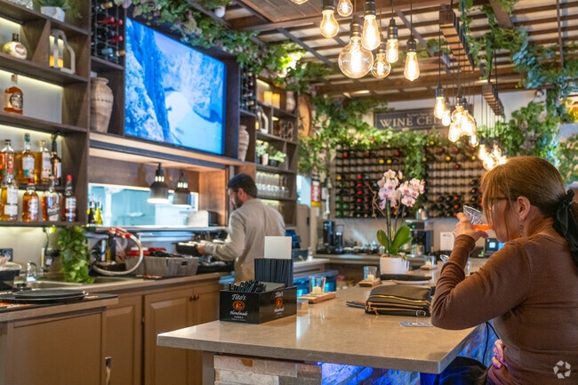 A woman enjoy a cocktail at Kelari Taverna & Bar in Pelham.