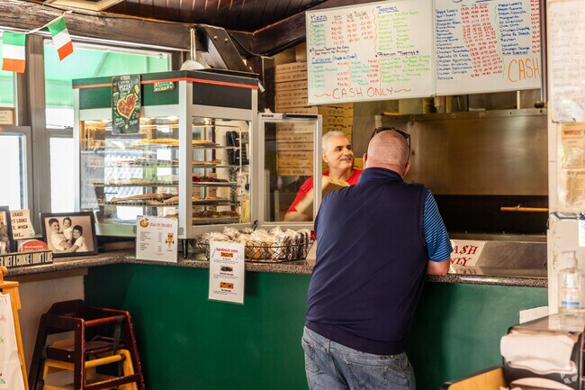 Stop into Gianni's Pizza in Nobscot for an amazing slice and a good joke.