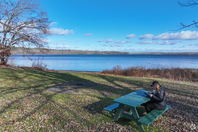 Hermon Pond offers calm waters for boating, fishing, and summer picnics.
