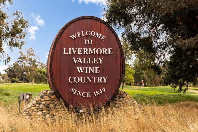 A decorative sign on a barrel welcomes visitors to the Livermore Valley neighborhood.