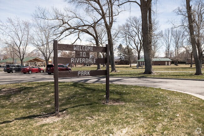 A wooden sign marks the entrance to Riverdale Park on Parker Drive.