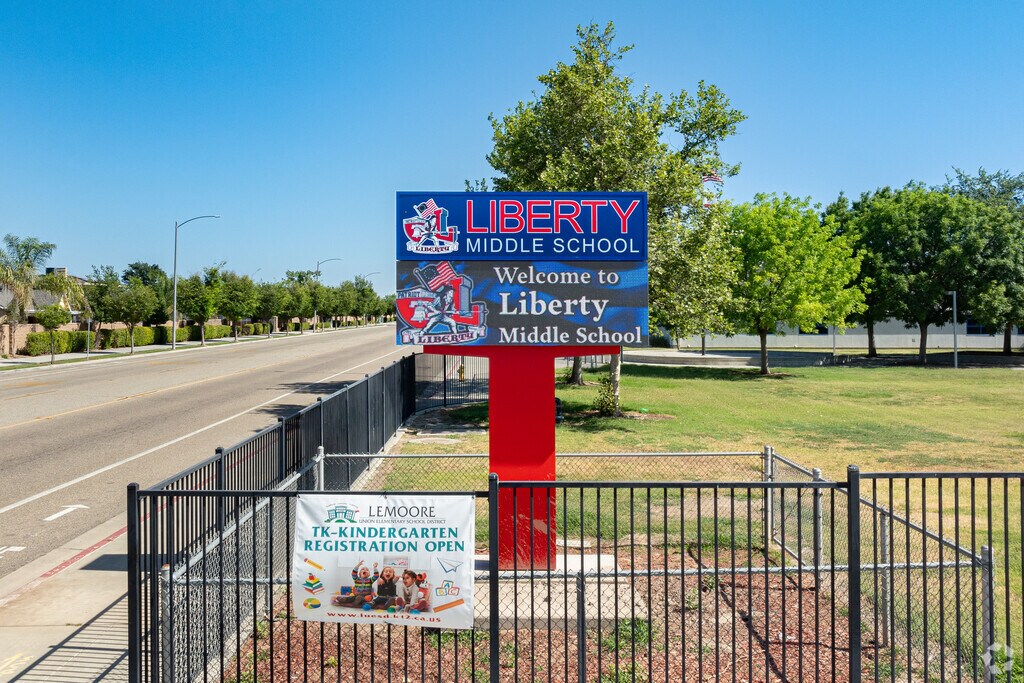 A large lighted marquee at the entrance to Liberty Middle School informs parents of events.