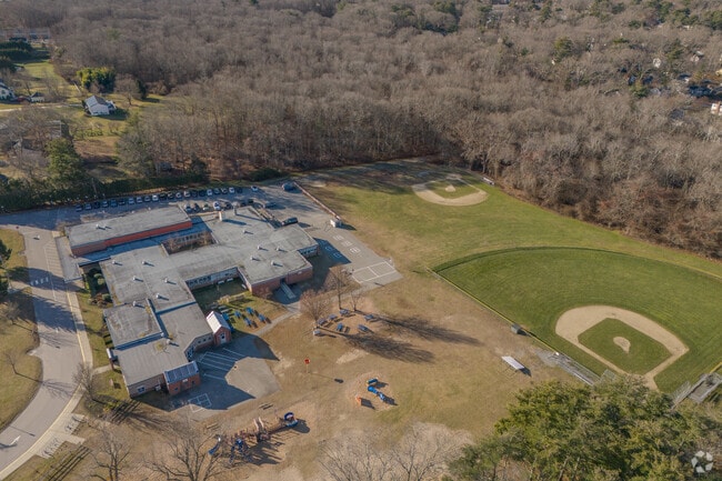 The Sowams Elementary School in Barrington sits on the edge of arboreal green space.