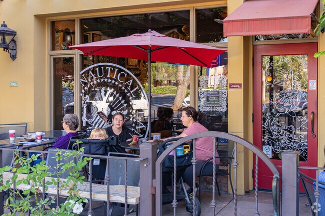 Friends gather for a morning coffee and breakfast burrito at a popular coffee shop near Prefumo.