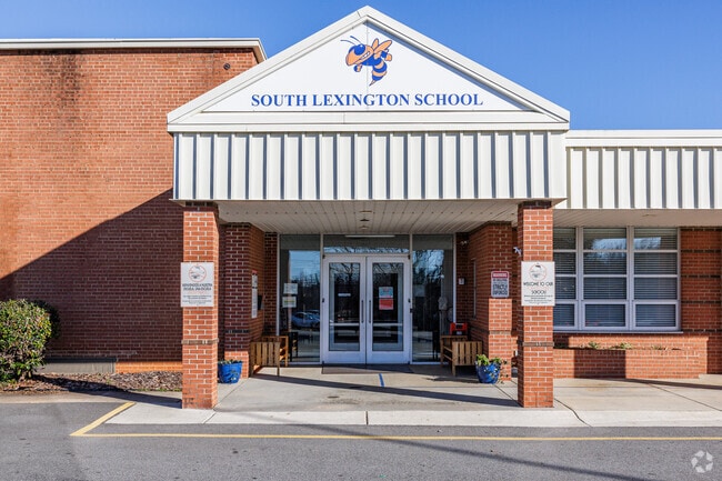 The entrance of South Lexington School radiates a warm and inviting atmosphere.