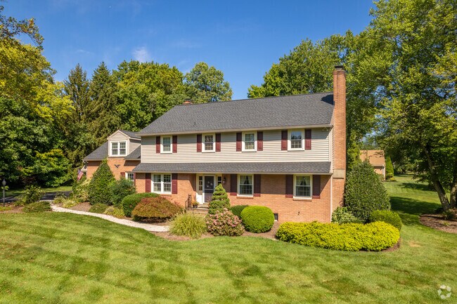 A beautiful Colonial inspired home in Carrcroft with a large yard and plenty of foliage.