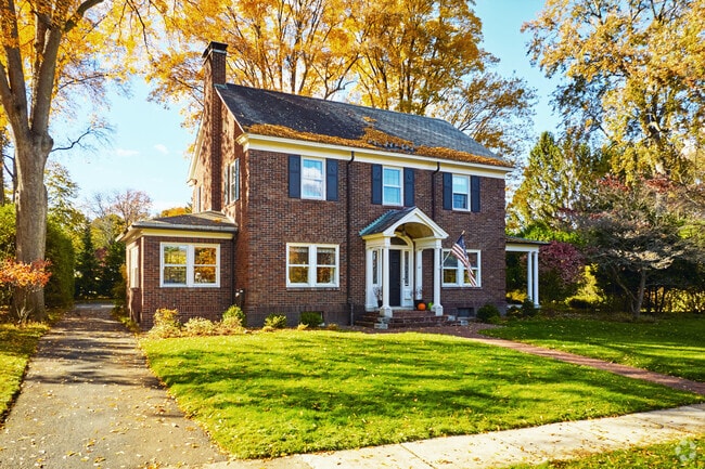 Elegant Colonial homes blend timeless charm with refined living in the heart of Fairport.
