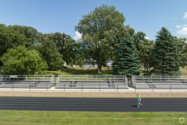 A man walks around the track at Harvard High School.