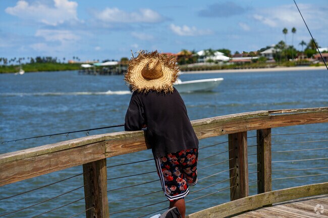 An Edgewater Landing resident enjoys watching boats pass by on the Indian River.