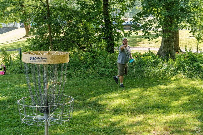 A disc golfer nails several putts as he practices for late-afternoon play in North Coventry.