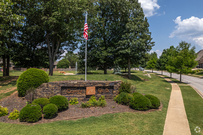 The neighborhood of Copper Creek welcomes its residents with tree lined streets.