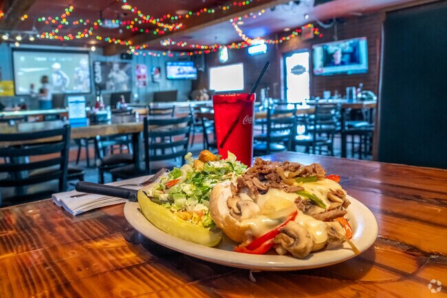 Grab a delicious Philly sandwich with a cold beer while at Daman's in Overlake.