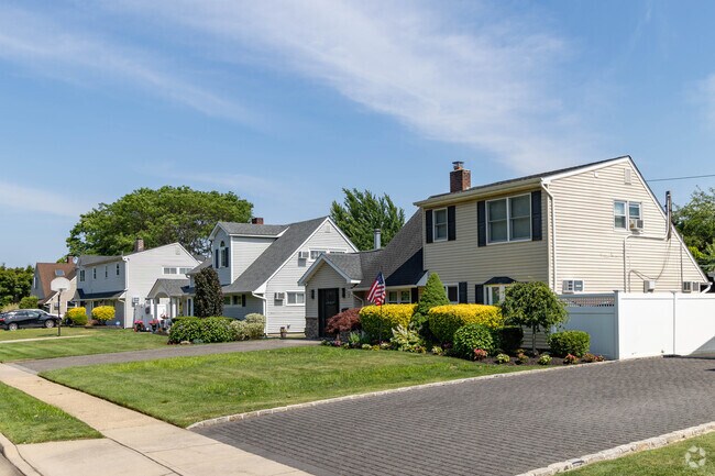 Many streets in North Wantagh are lined with rows of $600,000-plus expanded Cape Cod homes.