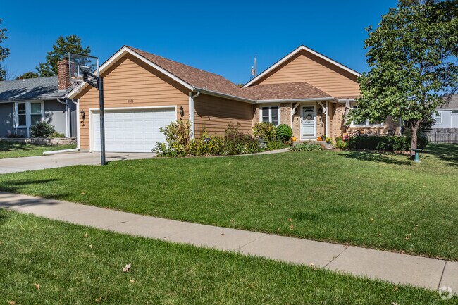 West Topeka has variety of brightly colored homes with one and two car garages.