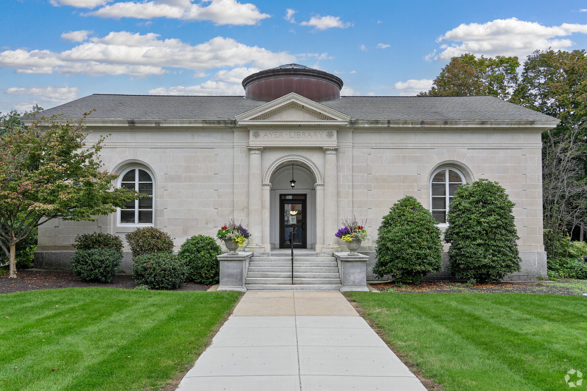 The Ayer Public Library features limestone walls.