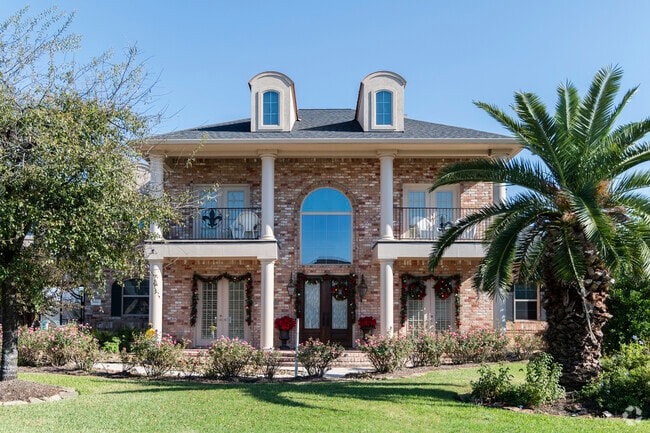 A stately colonial style home sits on a well manicured property in the Bent Water area.