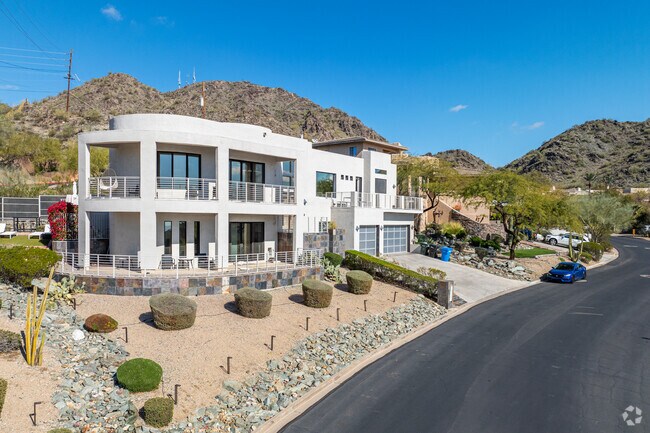 Hillside home in North Mountain Village boasts desert views through ample windows.