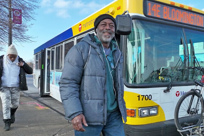 Local residents arriving at their destination on West Broadway Avenue.