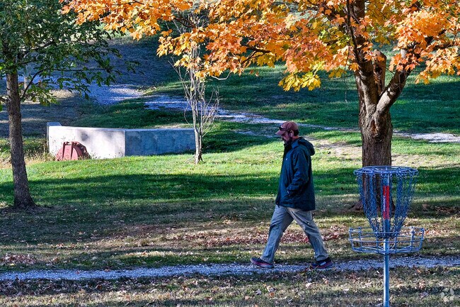 A man enjoys a brisk walk in Murdock Park near Sunnyside.