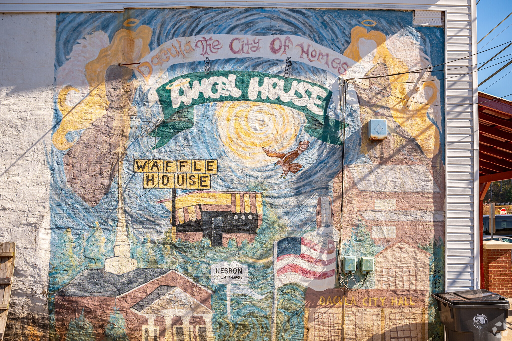 This mural was painted by a local artist showing life in Dacula.