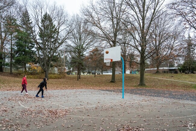 Friends enjoy a game of Basketball at Kennedy Park near the Heslop Morningview neighborhood.