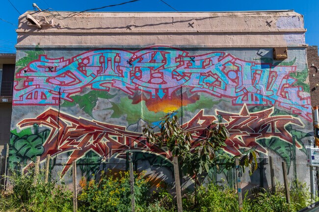 A beautiful mural in the neighborhood spells out its name, 