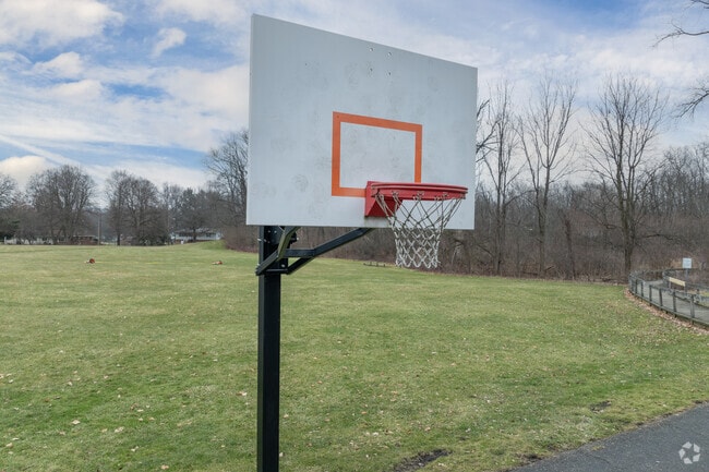 Children play basketball at Fort Island School.