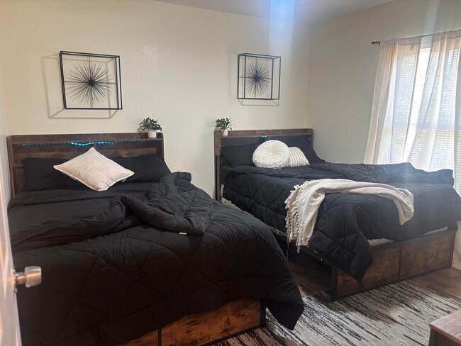 Room 1 includes two full sized beds.