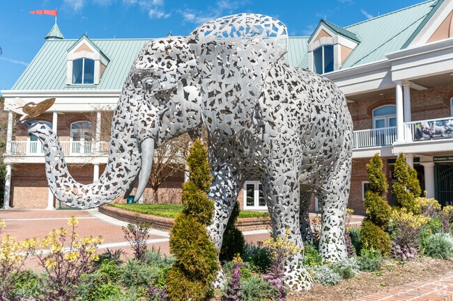 Children admire elephant statues at the Virginia Zoo's welcoming entrance in Lafayette-Winona.