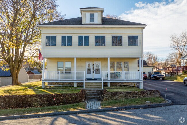 A multifamily style home in Cleghorn has three separate units with a large front porch.