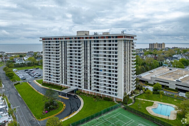 High-rise condominiums such as the Channel Club residences line Monmouth Beach.