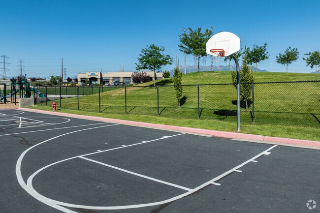 Syracuse Arts Academy’s basketball court overlooks a grassy knoll.