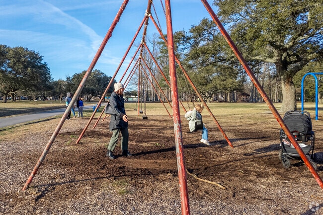 Kids swing high at Lafayette Park Playground in the heart of Lafayette-Winona.