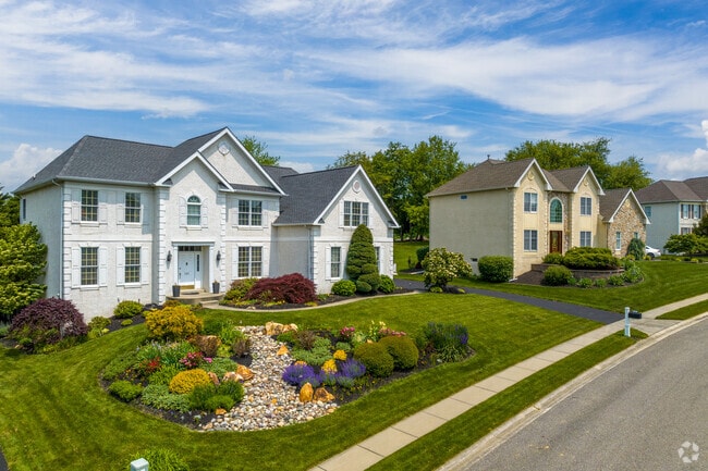 Large single-family homes in Hockessin often have colorful landscaping.