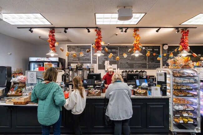 In West Medway, patrons eagerly line up at Muffin House Café for delicious bakery treats.