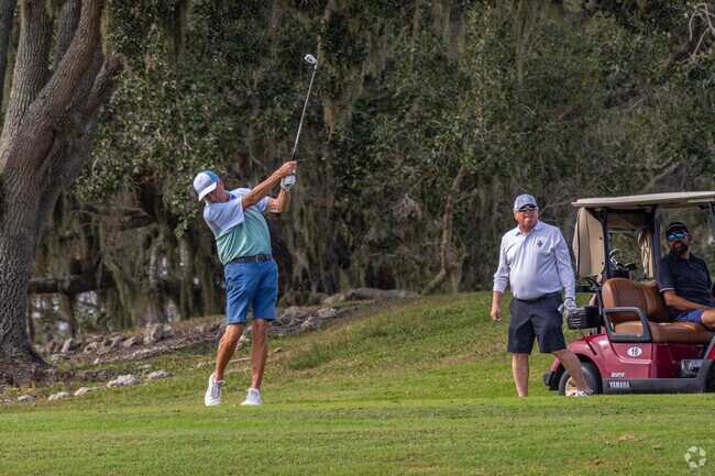 A golfer drives a ball from the green at Buffalo Creek Golf Course in East Ellenton.