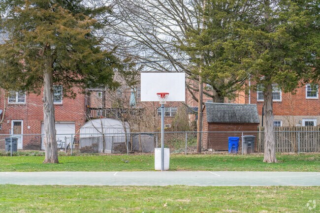 Residents head to the court at Terrace Lane Park for pickup.