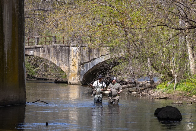 Ambitious anglers in Hampton, NJ wade through the river at the wonderful Hampton Borough Park.